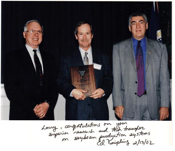 Receiving Technology Transfer Award from USDA-ARS Administrator Ed Knipling (L)